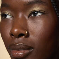 Model Wearing It's Gilt Gold Glitter Eyeshadow